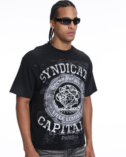 Man wearing a black t-shirt with 'Syndicate Capital' design on a white background