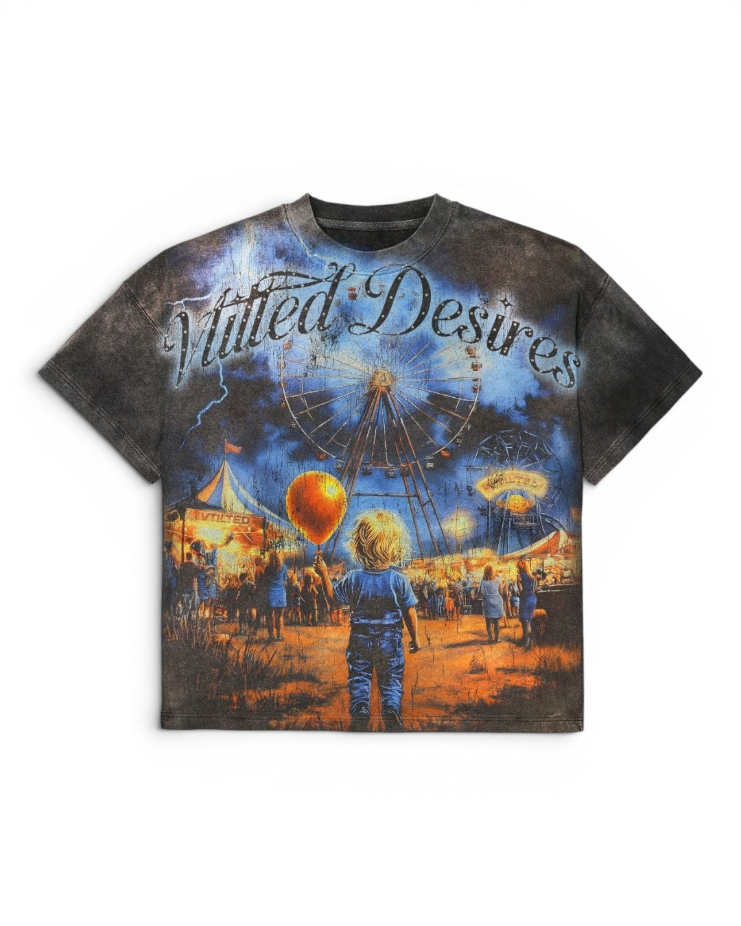 A short-sleeve crewneck t-shirt featuring a detailed graphic print of the text 'Vtilted Desires', showing a carnival scene with a Ferris wheel, hot air balloon, and a child in the foreground, set against a plain white background.