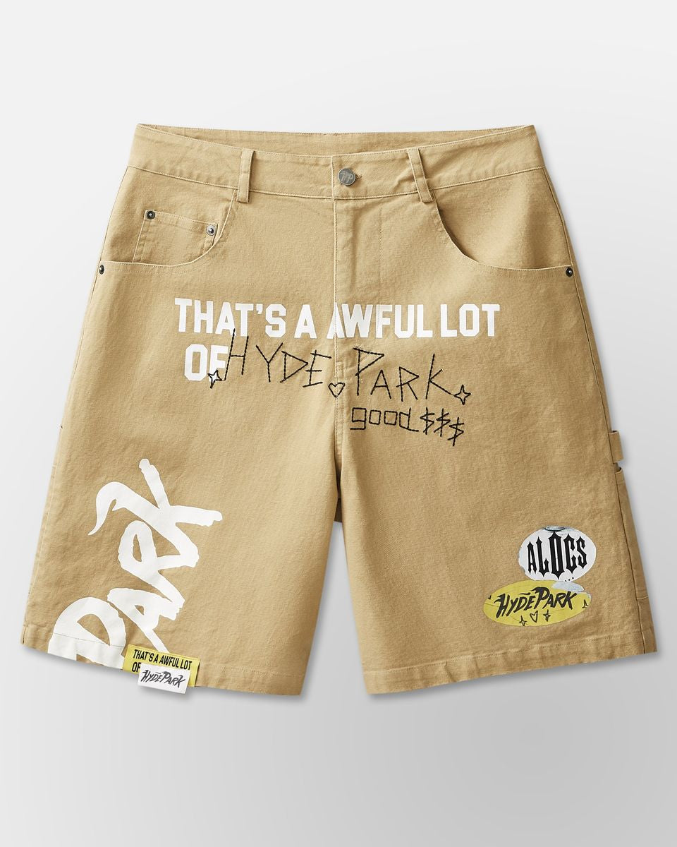 Beige shorts with text and brand logos on a light gray background