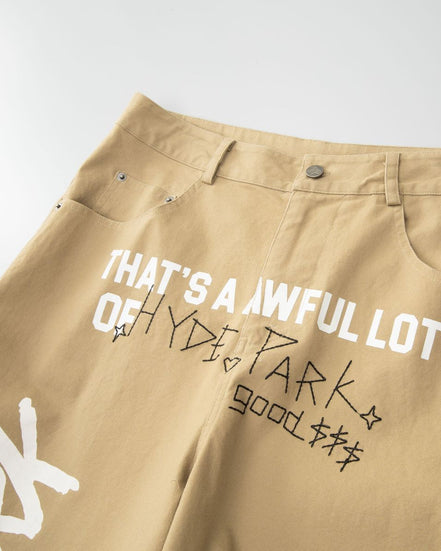 Beige pants with text and branding on a light gray background