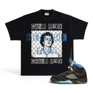 A black graphic t-shirt featuring a portrait of Mary Jane and the text 'CASH OUT BEFORE YOU CRASH OUT' in white and blue, shown next to a black and blue high-top sneaker on a white background.