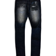 Back view of a pair of dark wash skinny jeans with a faded wash on the thighs, featuring a black brand tag on the back pocket and a white inner waistband label.