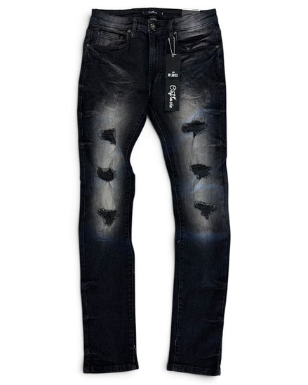 Distressed black denim jeans with faded gray wash details and ripped knee patches, shown flat against a white background with a hangtag attached.