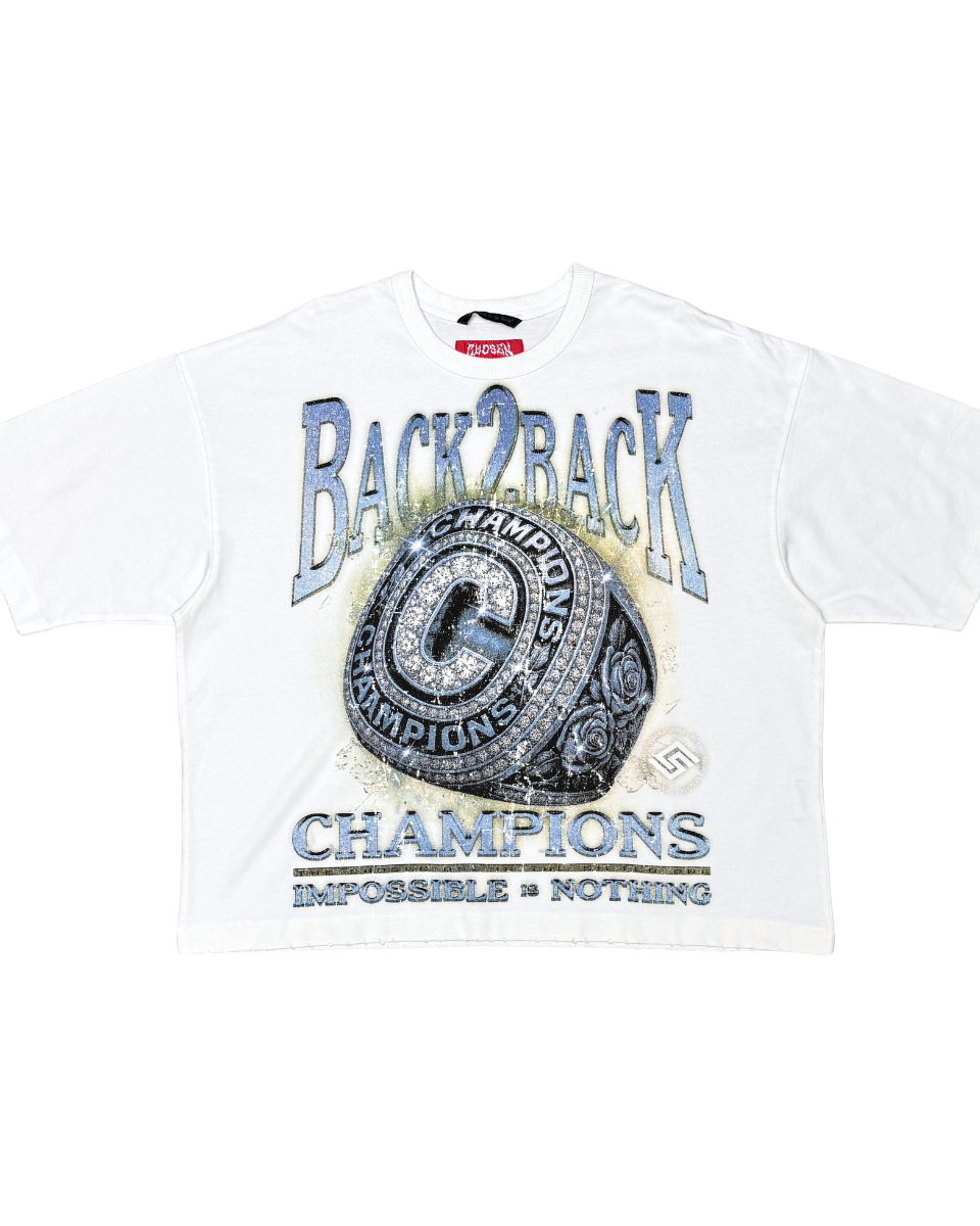 White t-shirt with 'Back2Back Champions' text and championship ring graphic on a white background