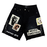 Black denim shorts with graphic designs and text on a white background