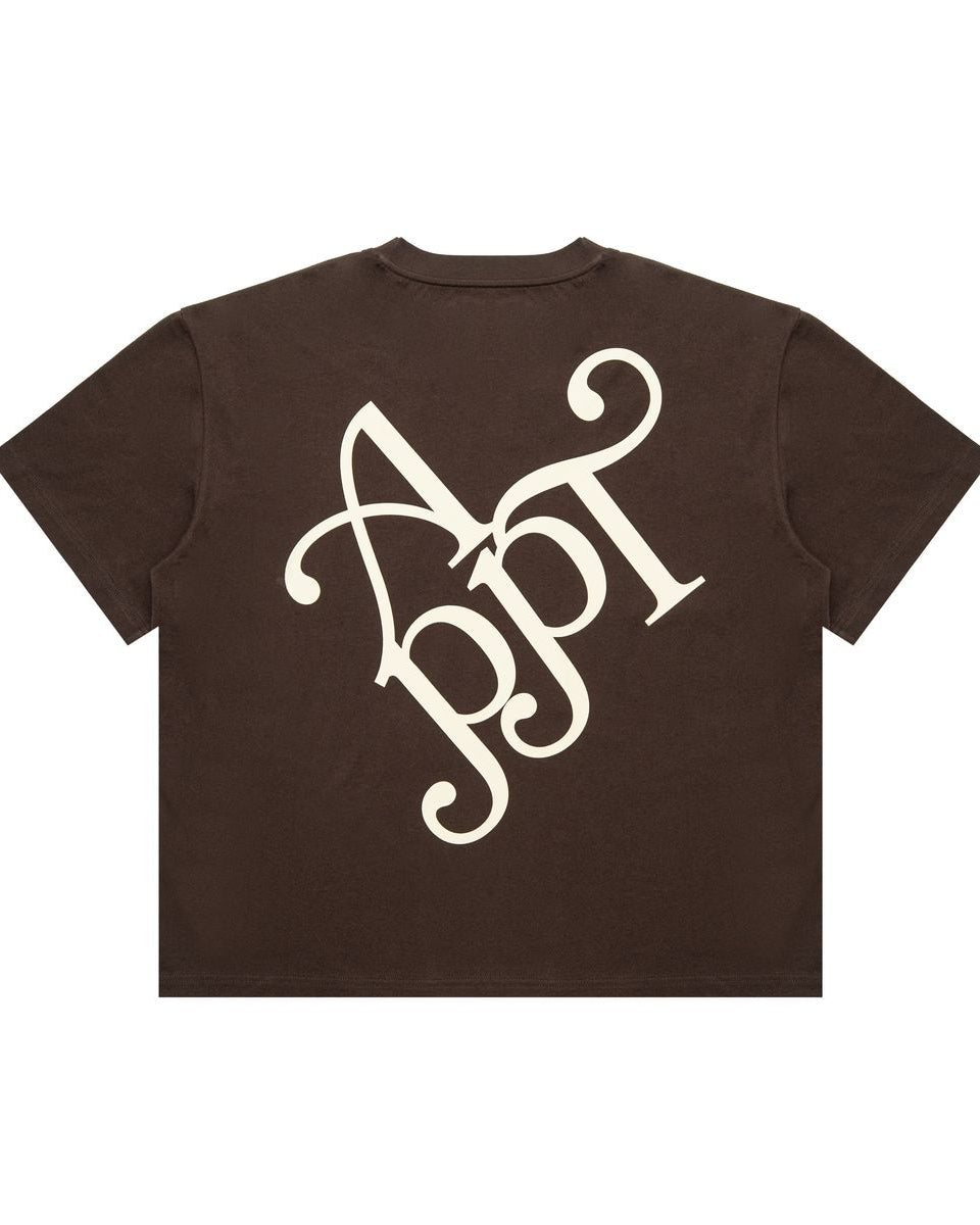 Brown t-shirt with a white monogram on a white background
