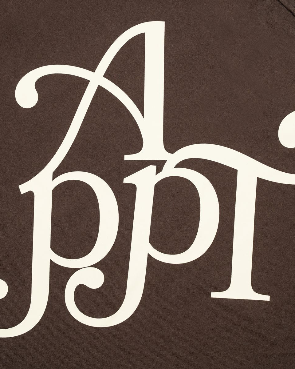 Decorative white monogram on a brown background