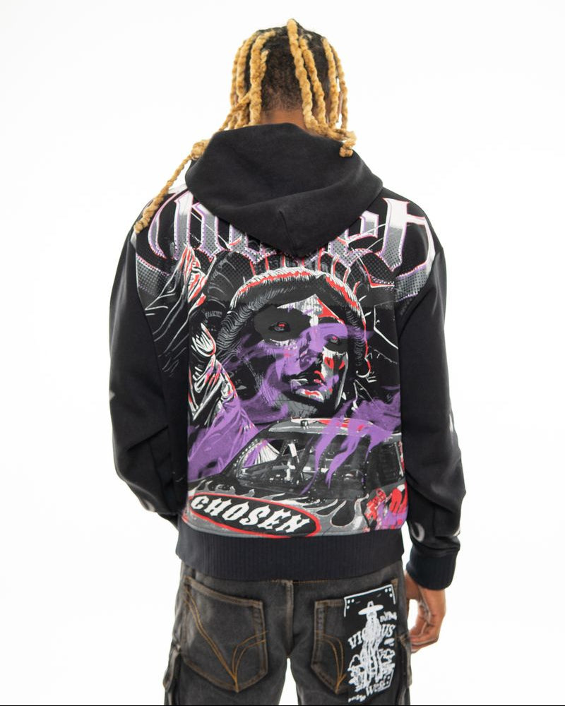 Person wearing a black hoodie with a colorful graphic design on the back, standing against a white background.