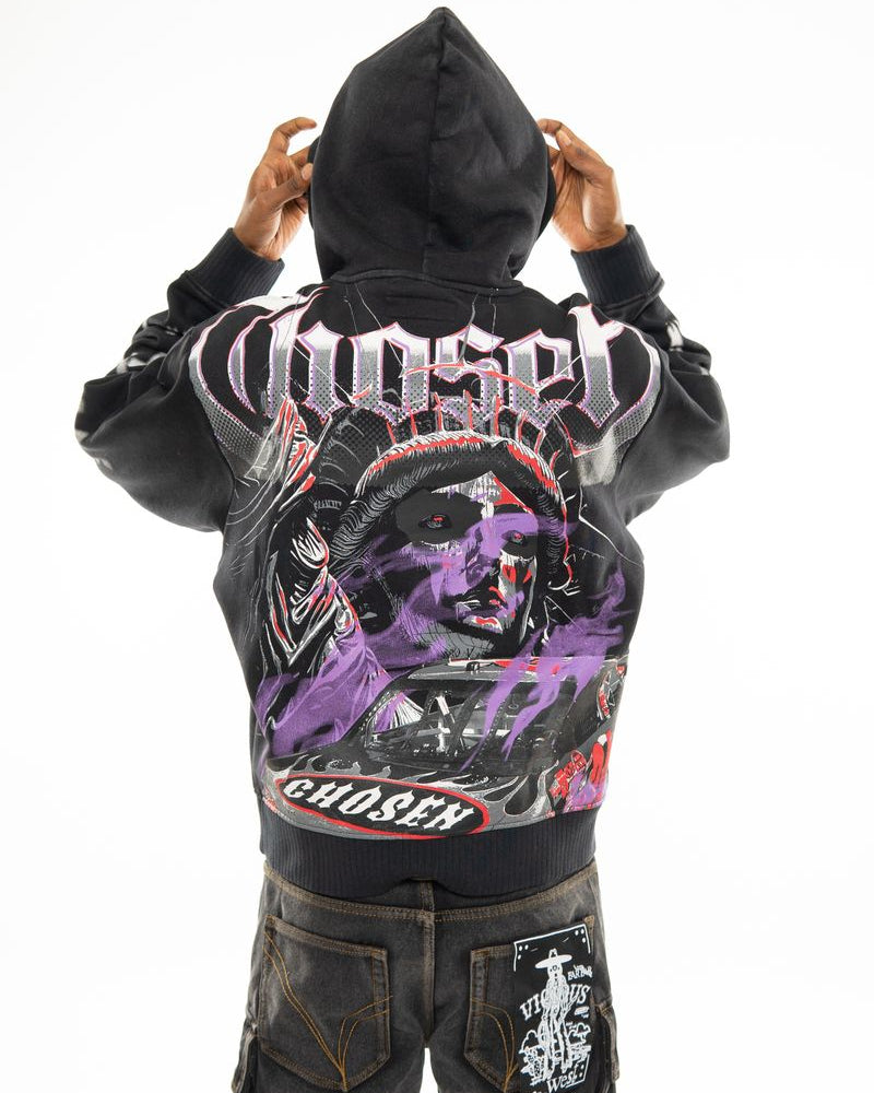 Person wearing a black hoodie with graphic designs and text on the back, on a white background.