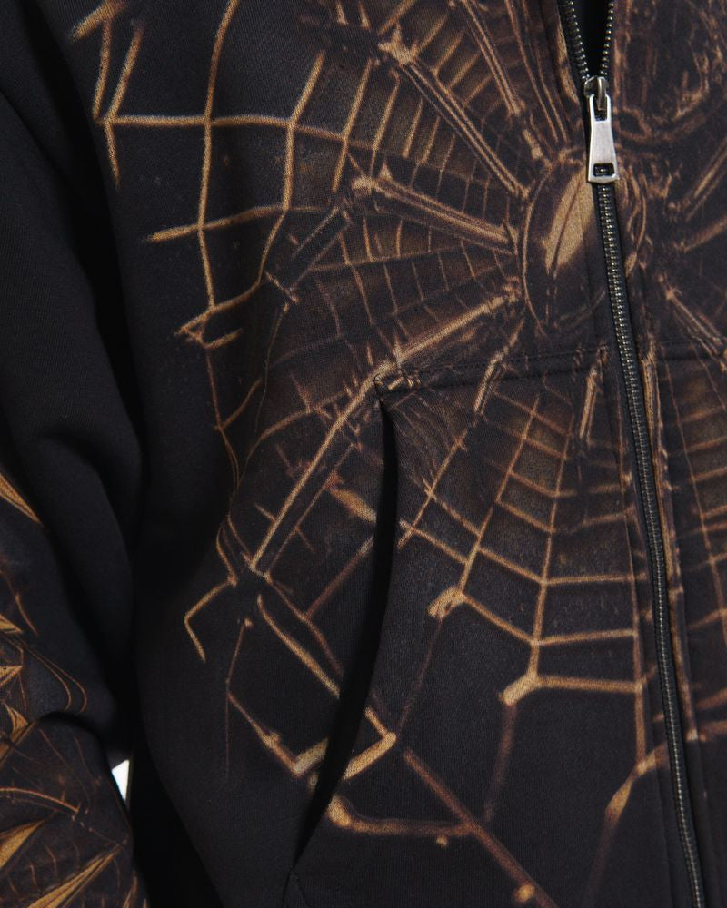 Black hoodie with gold spider web design and zipper
