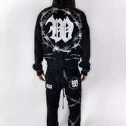Black hoodie and pants set with barbed wire design on a white background