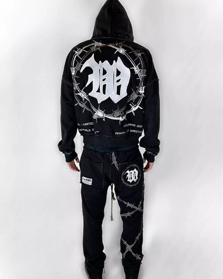 Black hoodie and pants set with barbed wire design on a white background