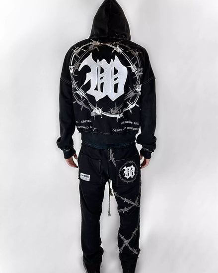 Black hoodie and pants set with barbed wire design on a white background