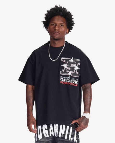 Man wearing a black t-shirt with graphic design and text on a white background