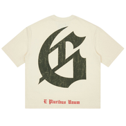 Beige t-shirt with large black letter 'G' and 'E Pluribus Unum' text on a white background