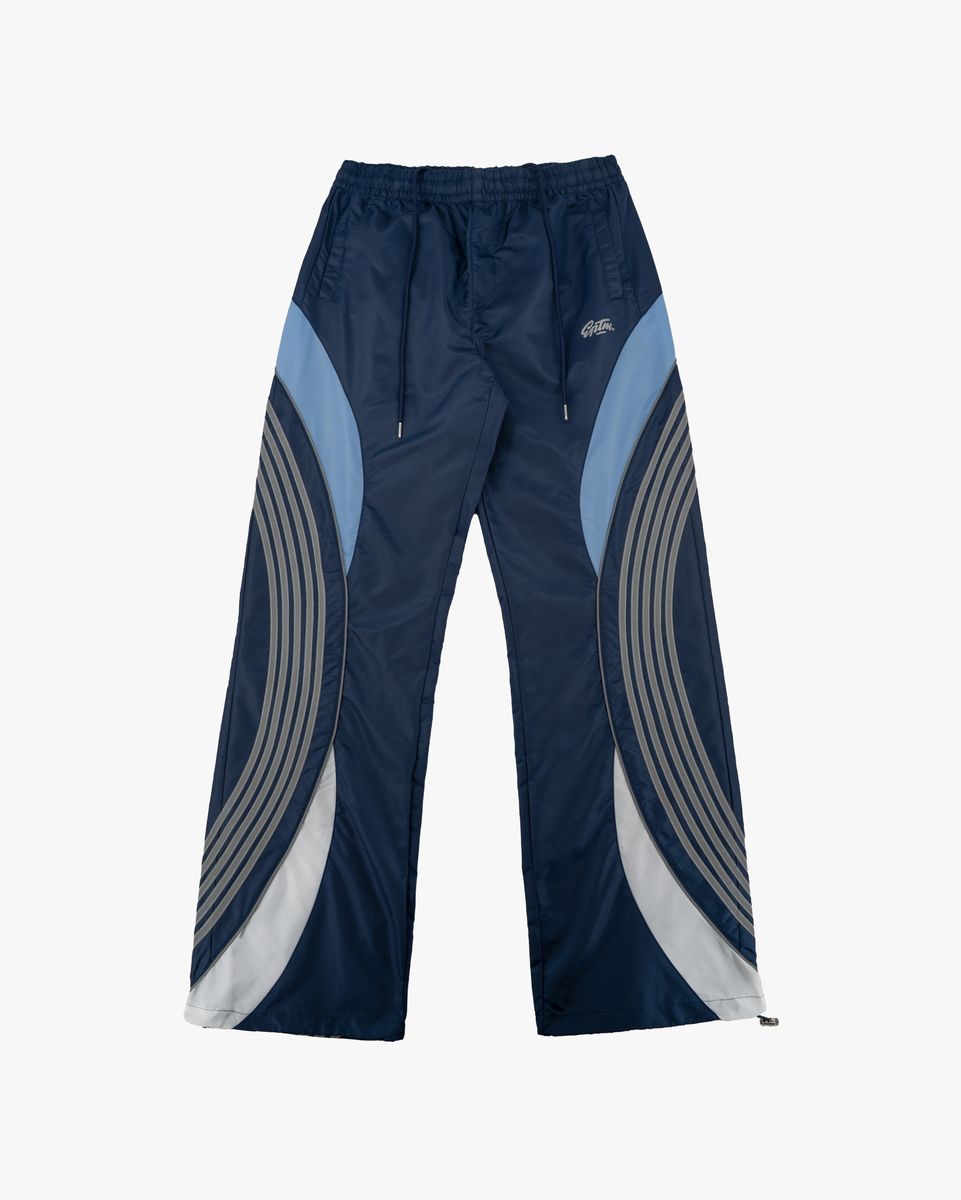 Navy blue pants with gray and light blue geometric patterns on a white background