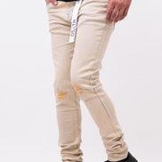 Beige pants with black shoes on a white background