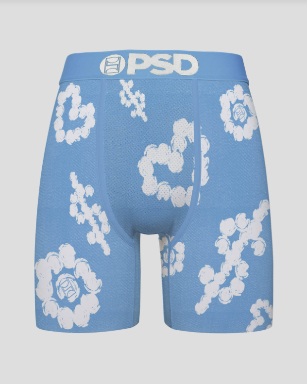 Blue boxer briefs with white floral patterns and 'PSD' branding on a gray background