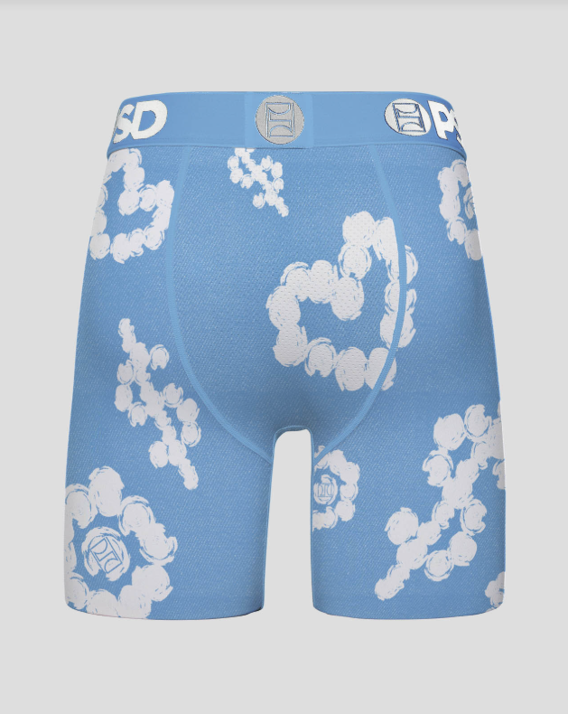 Blue boxer briefs with white floral patterns on a gray background