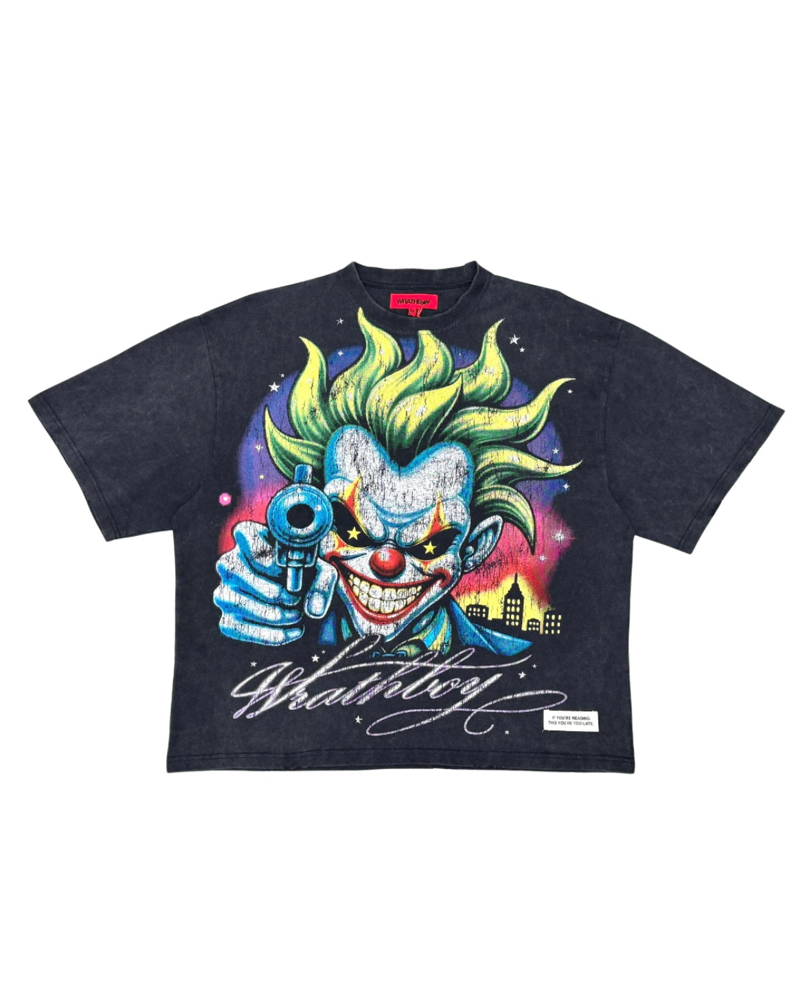 A dark charcoal gray graphic t-shirt featuring a detailed illustration of the Joker pointing a gun forward, with 'WRATHBOY' written in white script below, set against a plain white background.