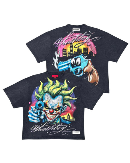 Two black graphic t-shirts featuring a colorful cartoon clown and a blue gun with a pink and yellow city skyline print, displayed against a white background.
