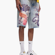 Person wearing a yellow shirt, colorful denim shorts, and white sneakers on a white background