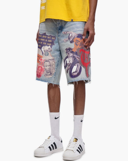 Person wearing colorful graphic shorts with a yellow top and white sneakers on a white background