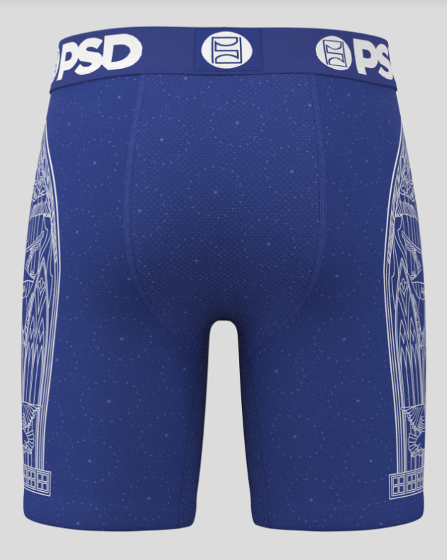 Blue athletic shorts with white patterns and 'PSD' branding on a gray background