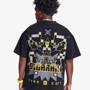 Person wearing a black t-shirt with graphic designs on the back, standing against a white background