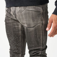 Black hoodie and gray jeans with rhinestone details on a white background