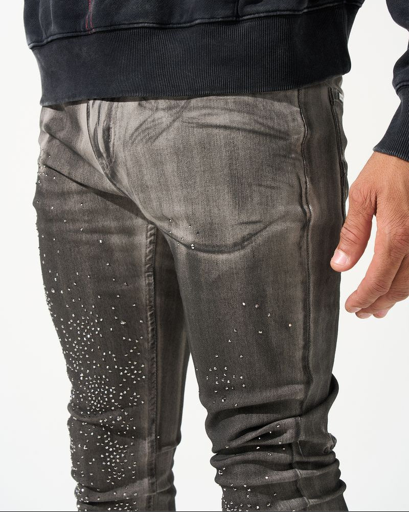 Black hoodie and gray jeans with rhinestone details on a white background