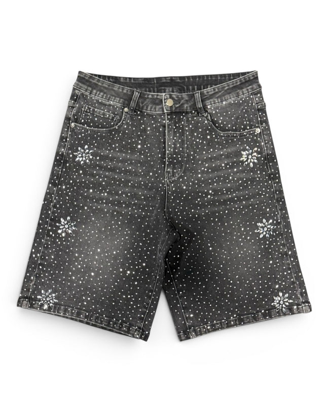 Black denim shorts with white floral patterns on a white background