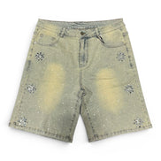 Denim shorts with embellishments on a white background