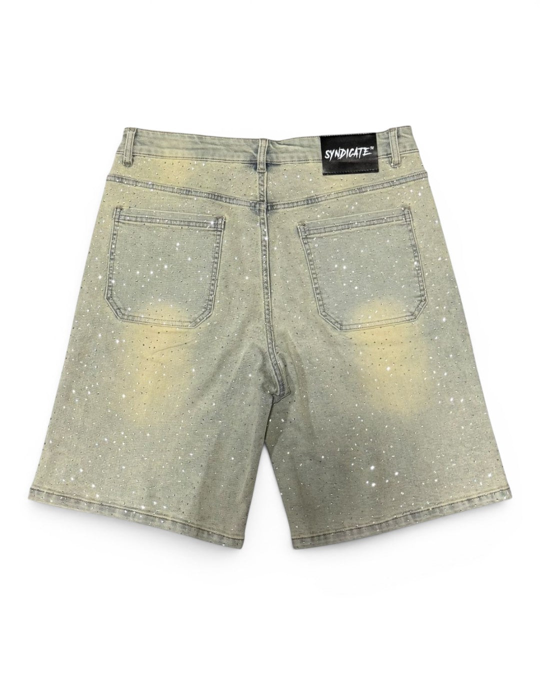 Back view of light-colored denim shorts with a brand label on a white background