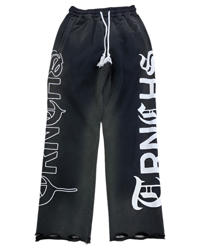 Black sweatpants with white branding on a white background