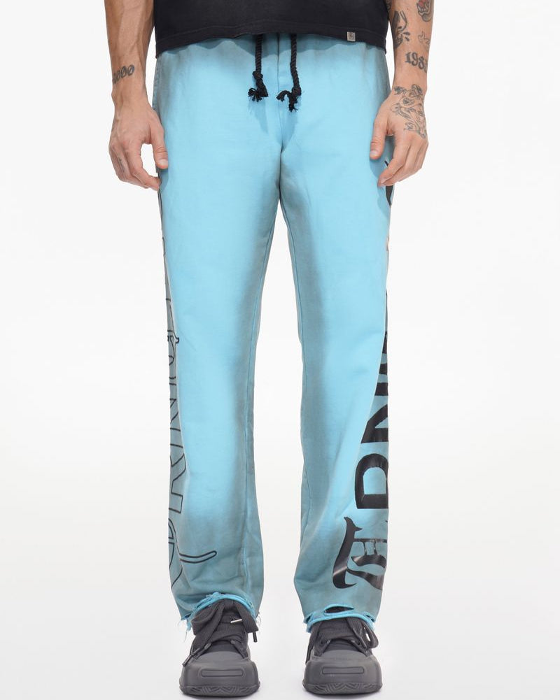 Person wearing light blue pants with black text on a white background