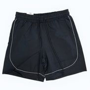 Black shorts with white piping on a white background