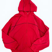 Red jacket with black accents on a white background