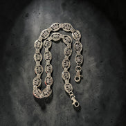 SILVER WALLET chain on a textured dark surface