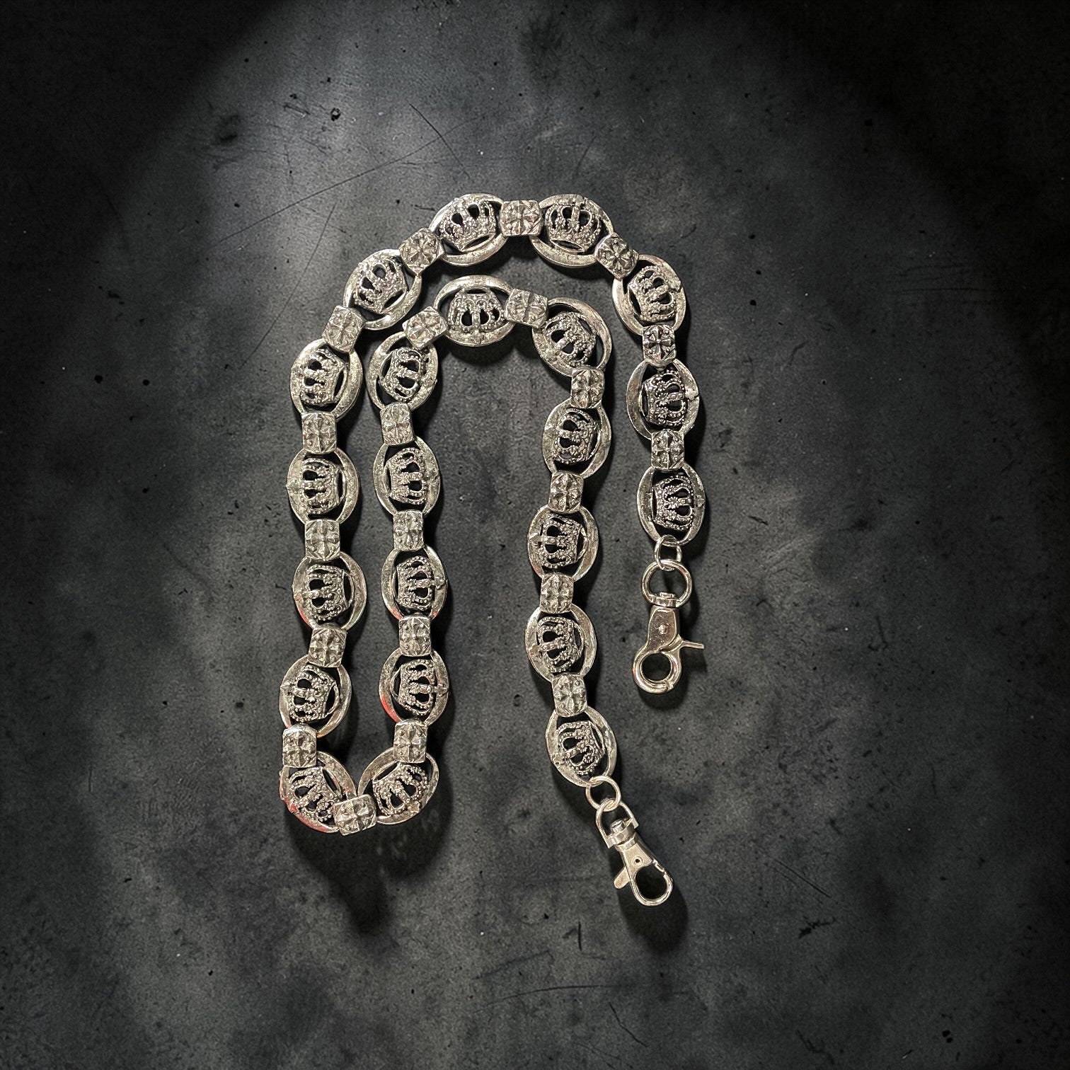 SILVER WALLET chain on a textured dark surface