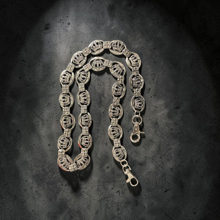 SILVER WALLET chain on a textured dark surface