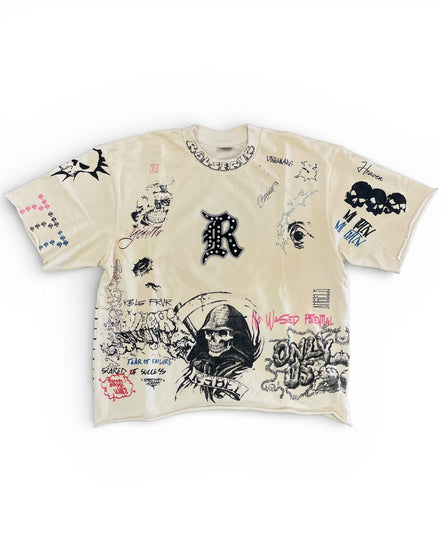 Beige t-shirt with black and white graphics and text on a white background