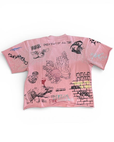Pink t-shirt with black graphics and text on a white background