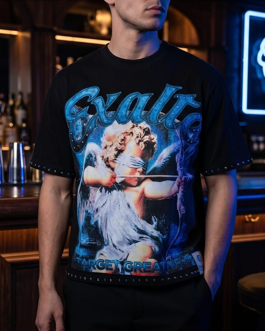 Person wearing a black t-shirt with a graphic design in a bar setting