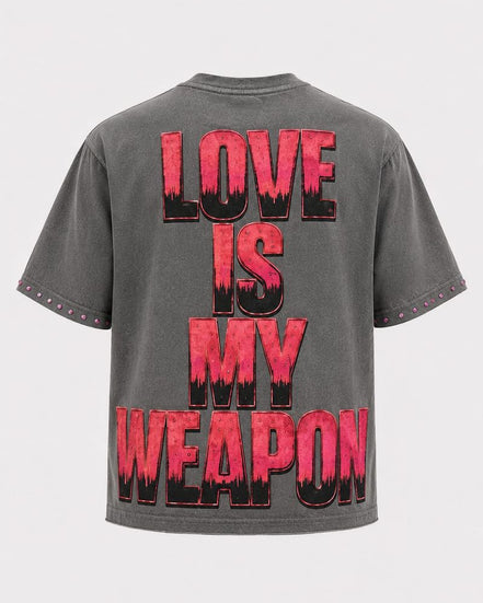 Gray t-shirt with red and black text 'LOVE IS MY WEAPON' on a white background