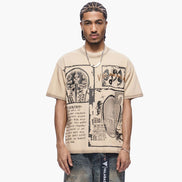 Person wearing a beige t-shirt with graphic design on a white background