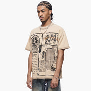 Man wearing a beige t-shirt with graphic design on a white background