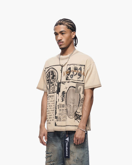 Man wearing a beige t-shirt with graphic design on a white background