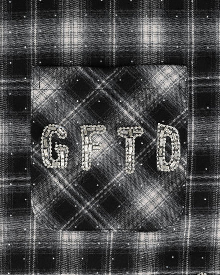 Black and white plaid fabric with 'GFTD' text