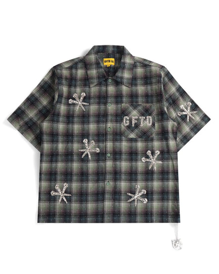 Plaid shirt with embroidered designs and text on a white background